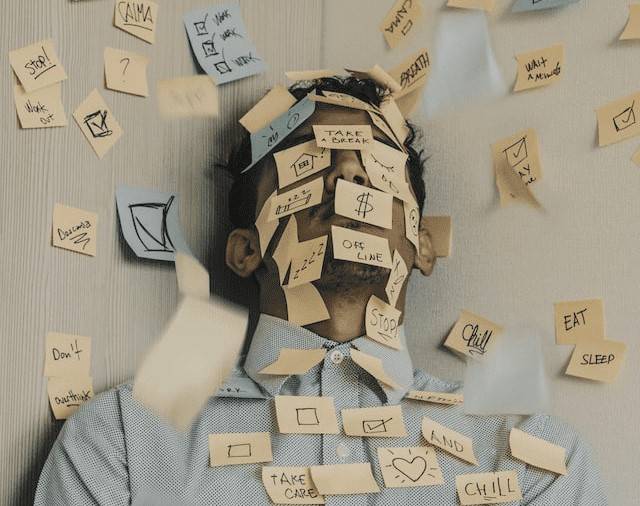 Man covered in post-it notes