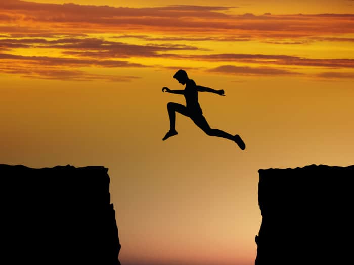 Man jumping over a chasm