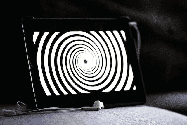 A tablet displaying hypnosis spiral